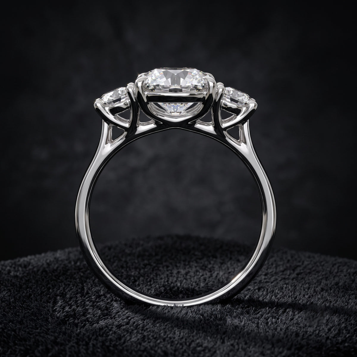 Three Stone Diamond Ring with Oval Center Stone and Round Side Diamonds